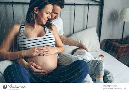 To execute woman who cut unborn baby from pregnant friend, told husband it was theirs. Pregnant Woman With Husband Looking Sleeping Son A Royalty Free Stock Photo From Photocase