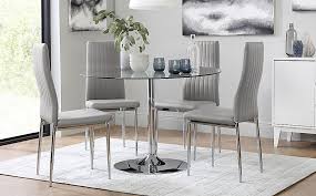 Glass dining tables | round glass top table sets. Orbit Round Chrome And Glass Dining Table With 4 Leon Light Grey Leather Chairs Furniture And Choice