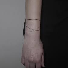 Flower wrist tattoos remain a popular choice for many reasons. 40 Beautiful Bracelet Tattoos For Men Women Tattooblend