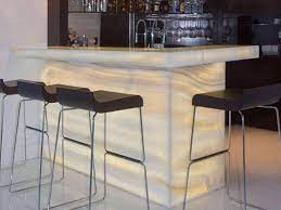 The sleek monolithic cantilevered backlit onyx bar sets the chic mood at the rooftop bar. Backlighting Onyx Kitchen Countertops And Bar Tops For Sale Eonyx Factory