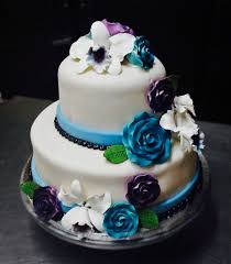 Maybe you would like to learn more about one of these? Elegant Violet And Blue Fondant Wedding Cake With Edible Flower Ensembles Made By The Patisserie Cake Fondant Wedding Cakes Edible Flowers Cake