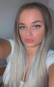 Moment nursery worker smirks as she's arrested after attacking 21 babies  including one she kicked in face FOUR times