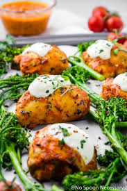 45 Degree Angle Shot Of A Sheet Pan Topped With Broccoli And Chicken Fra Diavolo With The Focus On One Harissa Chicken Chicken Pasta Recipes Sheet Pan Recipes