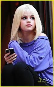 Every single recorded by selena (solo, collabs, droplets, and with the scene) that's commercially released. Selena Gomez Dons Blonde Wig Photo 39011 Selena Gomez Pictures Just Jared Jr