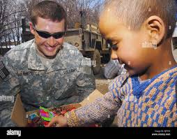 Us army soldier orphanage in hi-res stock photography and images