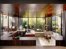 To get to the kitchen, family room, or bedrooms, one must walk through the dining room, because all rooms are connected through multiple entrances to the dining room. Sunken Designs Let You Explore The Depths Of Style