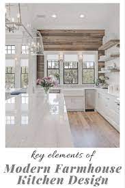 It is echoed in style by the backsplash and countertop, made with calacatta marble. Key Elements Of Modern Farmhouse Kitchens Little House Of Could Modern Farmhouse Kitchens Farmhouse Kitchen Design Modern Farmhouse Style Living Room