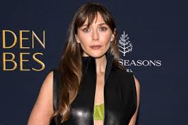 Elizabeth Olsen Paired Her Plunging Leather Dress with a Neon Green Bra at  the 2025 Golden Globes Party at TIFF