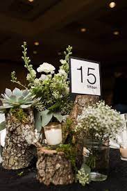 27 Rustic Wedding Decorations You Must Have A Look Wooden Stump With Succulent A Flower Centerpieces Wedding Wedding Centerpieces Wedding Floral Centerpieces