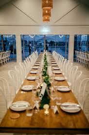 Wedding Reception At Pier 33 With Long Tables Lush Greenery Coast Wedding Wedding Wedding Reception