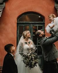 The sweetheart neckline echos the curves in the heart and wing design on her. Tattooed Bride In An Essense Of Australia Mermaid Wedding Dress For An Intimate Family Wedding Rock My Wedding