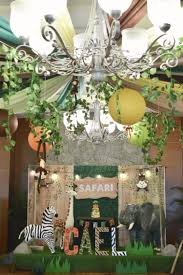 This blog post provides great decoration tips and ideas for the best jungle safari theme yet! Safari Themed Stage And Ceiling Design Safari Theme Party Safari Party Party Themes