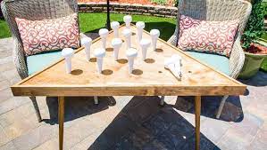 Giant oversized wooden dice yardzee game backyard games wood yard marble game board plans. Diy Life Sized Peg Game Outdoor Table Ken Wingard Is Making A Fun Game That Is Perfect For Your Summertime Diy Yard Games Outdoor Yard Games Giant Yard Games