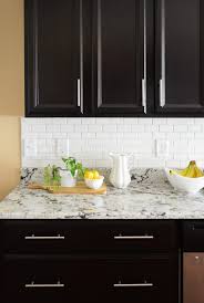 How To Install A Subway Tile Kitchen Backsplash Young House Love Subway Tile Backsplash Kitchen Kitchen Tiles Backsplash Backsplash With Dark Cabinets