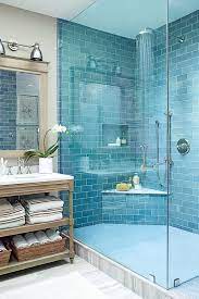 See more ideas about tile bathroom, blue tiles, bathrooms remodel. Blue Bathroom With Grey Marbled Tile Floor And A Vintage Wooden Vanity Simple Bathroom Bathroom Interior Design Beach House Bathroom
