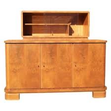 Crafted from wood veneers, it showcases a silhouette that fits into a corner while a warm mahogany finish is neutral enough for nearly any ensemble. Bar Display Cabinets 7 For Sale On 1stdibs