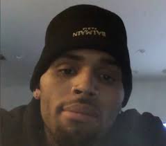 Chris Brown is posting videos from his live stand-off with armed police