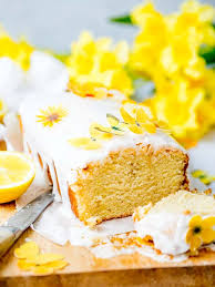 Vegan Lemon Drizzle Cake With Lemon Icing And Sugar Paper Flowers So Zingy Moist And Delicious Vegan Lemon Drizzle Cake Lemon Drizzle Cake Vegan Lemon Cake