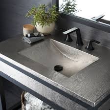 The hammered copper's texture is beautifully displayed by its contours. Luxury Bathroom Vanity Tops Native Trails