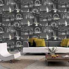 A patterned rug and pillows add dimension to the room, while black interspersed with neat white lines makes for a beautiful room. Holden Decor Night City Black White Wallpaper 11330