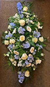 Then pick if you'll send it to the funeral home or their own personal residence. Blue And Cream Coffin Spray Funeral Flowers Marlowe Florist