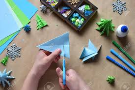 Use cardstock paper or thick paper to make cards. Making Origami 3d Xmas Tree With Paper For Decoration Or Greeting Card Merry Christmas And Happy New Year Children S Diy Concept Handmade Crafts On Holiday With Your Own Hands Stock Photo Picture