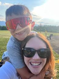 Lost red baseball sunglasses at lake