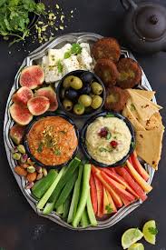 Middle eastern spiced green beans with olive oil and tomato (loubieh bil zayt)an edible mosaic. Mezze Platter Vegetarian Meditteranean Appetizers Fun Food Frolic