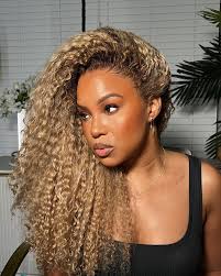 Merry Christmas Eve friend! 🤎 do you have a Christmas wig? Shout out to  @rpgshowwig for my holiday hair 🌲🎄 Link in bio and stories👆🏾 Link to  the same wig:  https://www.rpgshow.com/long-middle-part-curly-beige-ash-blonde-with-highlights-lace-front  ...