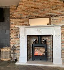 Both the ambition 5 and higher output 8 are available in either a black or grey painted finish and can be elevated with a log store as shown. Heta Ambition 8 8kw Nominal Wood Burning Stove Black Naturalheating Co Uk