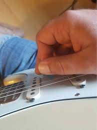 Fingerpicking position rest your forearm on the top front edge of the lower bout to stabilize. How To Hold A Guitar Pick Beginner Guitar Hq