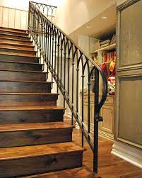 The wood and rod iron deck railings are one of the most popular designs. Wood And Wrought Iron Railing Rustic Stairs Of Wood With A Wrought Iron Handrail And Ban Wrought Iron Stair Railing Stairs Design Interior Stair Railing Design