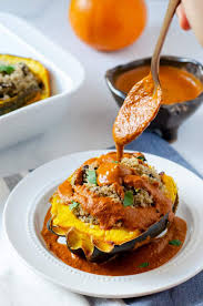 Vegan Quinoa Stuffed Acorn Squash With Sauteed Mushrooms Greens And A Pipian Rojo Makes A Gr Mexican Food Recipes Vegan Mexican Recipes Acorn Squash Recipes