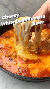 Nytcooking On Instagram Itsalislagle S Cheesy White Bean Tomato Bake Is The Unofficial Dish Of Frigid Winter Days Vide In 2021 Food And Drink Favorite Recipes Food