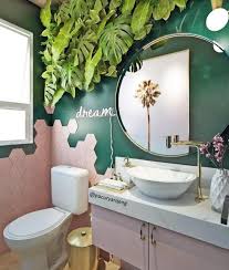 A bright tropical bathroom with banana leaf wallpaper, white tiles, a pink bench with storage and a lit up mirror. 50 Amazing Tropical Bathroom Decor Ideas Digsdigs