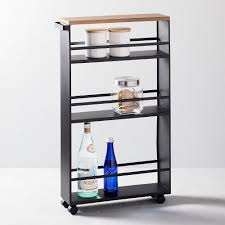 Our spice jars are designed to fit these shelves. Yamazaki Rolling Storage Cart W Handle Black