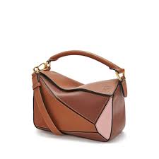 Small loewe puzzle bag size. Innovative And Highly Crafted Puzzle S Distinctive Cuboid Silhouette Has Become A Loewe Icon Here Scaled Down Luxury Crossbody Bag Bags Luxury Cross Body Bag
