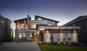 How does a custom home design company work? Incredible Exterior Home With Lighting Built By Birkholz Homes In Edmonton House Exterior House Design Exterior House Colors