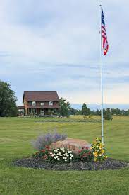 Jun 15 2019 explore stephanie andersen s board flagpole landscaping on pinterest. How To Add An In Ground Flagpole Landscape Around It Creative Cain Cabin
