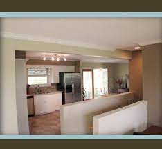 Afterstanding In Living Room Looking To Now Open Kitchen And Den You See The New Stairs To Basement Open Basement Stairs Stairs In Kitchen Stair Remodel