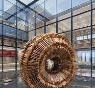 Wood carved spherical sculpture