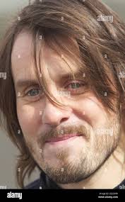 Scottish drummer Neil Primrose of Travis band, takes part in a motor racing 