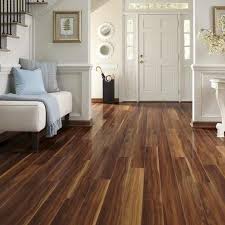 The Low Down On Laminate Vs Hardwood Floors Walnut Laminate Flooring House Flooring Flooring