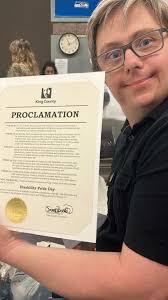 Eric accepting the proclomation for disability pride