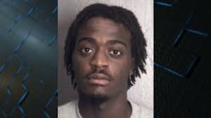 Murder suspect accused of assaulting officer at detention center