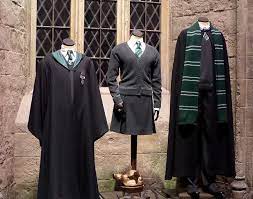 The slytherin sweater is dark grey with green and white accents around the wrists and bottom of the sweater. Hp019 Harry Potter Outfits Harry Potter Uniform Harry Potter Cosplay