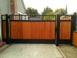131218 Iron Wood Gates At Www Ccoigateandfence Com Driveway Gate Custom Design Automatic Gate Electric Gate Wood Gates Driveway Wood Gate Wood Fence Design