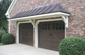 Metal roof over front door. Porticos Can Transform A Flat Fronted House With Little Effort A Front Door Overhang Creates Contrast Dep Garage Door Design Garage Doors Double Garage Door