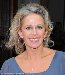 a little grey matter for ex eastender lucy benjamin as she lets her silver roots show grey hair inspiration silver grey hair silver white hair