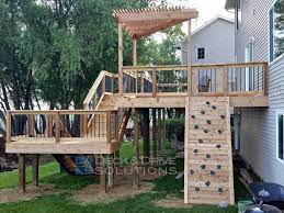 New Cedar Deck With Slide And Rock Wall Deck And Drive Solutions Decks Backyard Cedar Deck Building A Deck